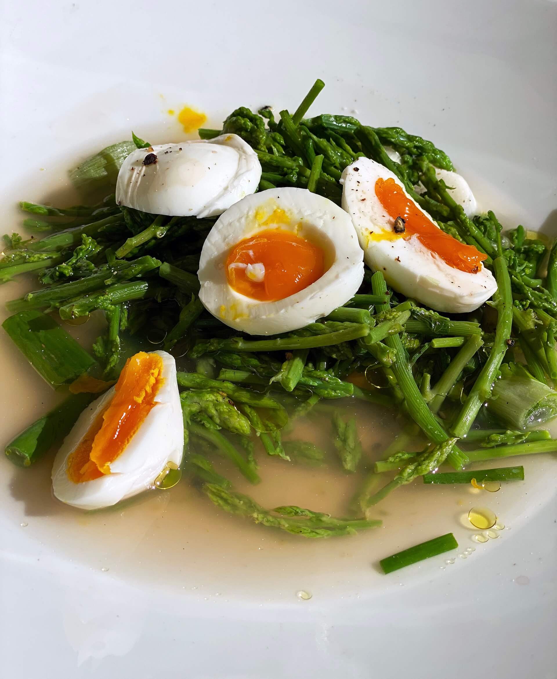Wild asparagus with soft-boiled eggs and olive oil.
